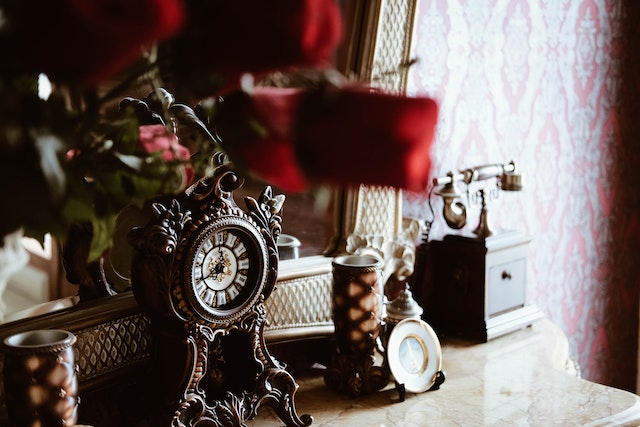 antique items sitting on a dressed in front of a mirror